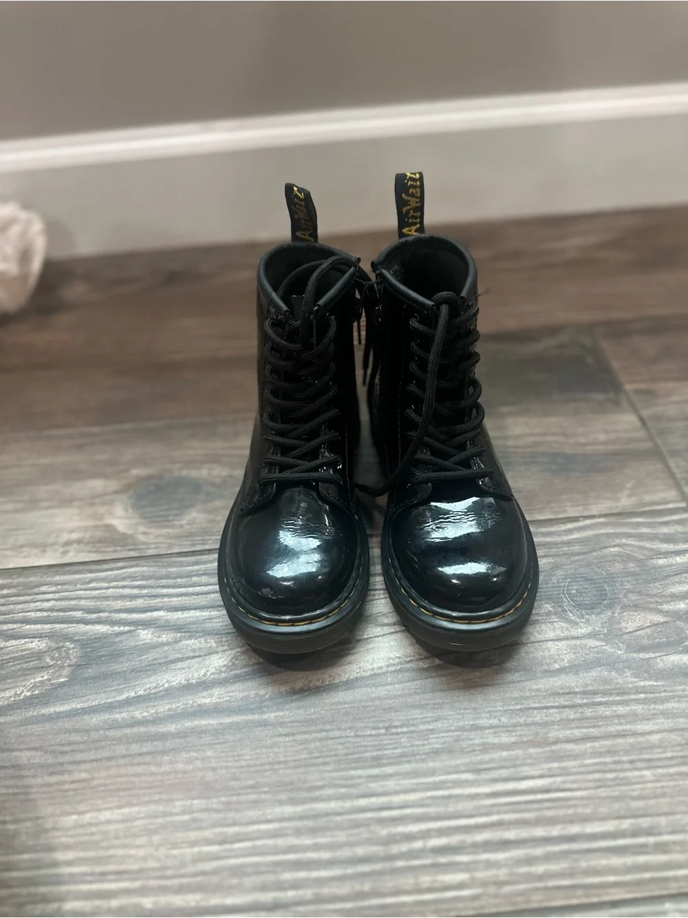Dr. Martens Kids Black Patent Lace-Up Combat Boots with Yellow Heel Loop